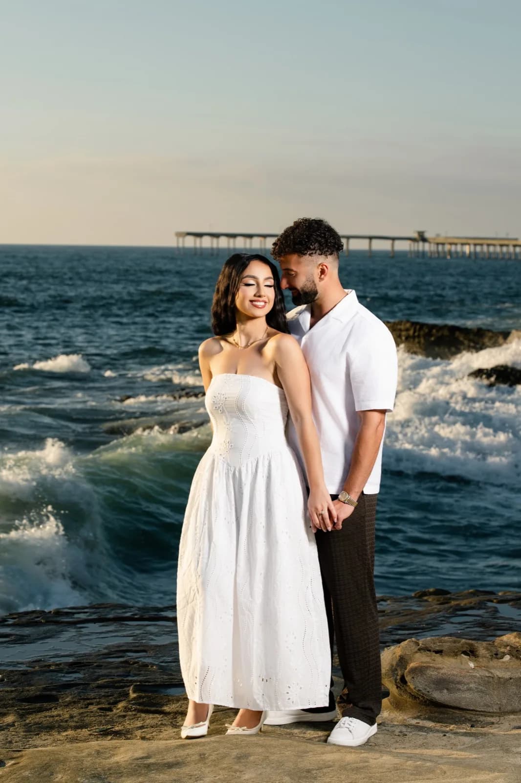 Standing together by the ocean